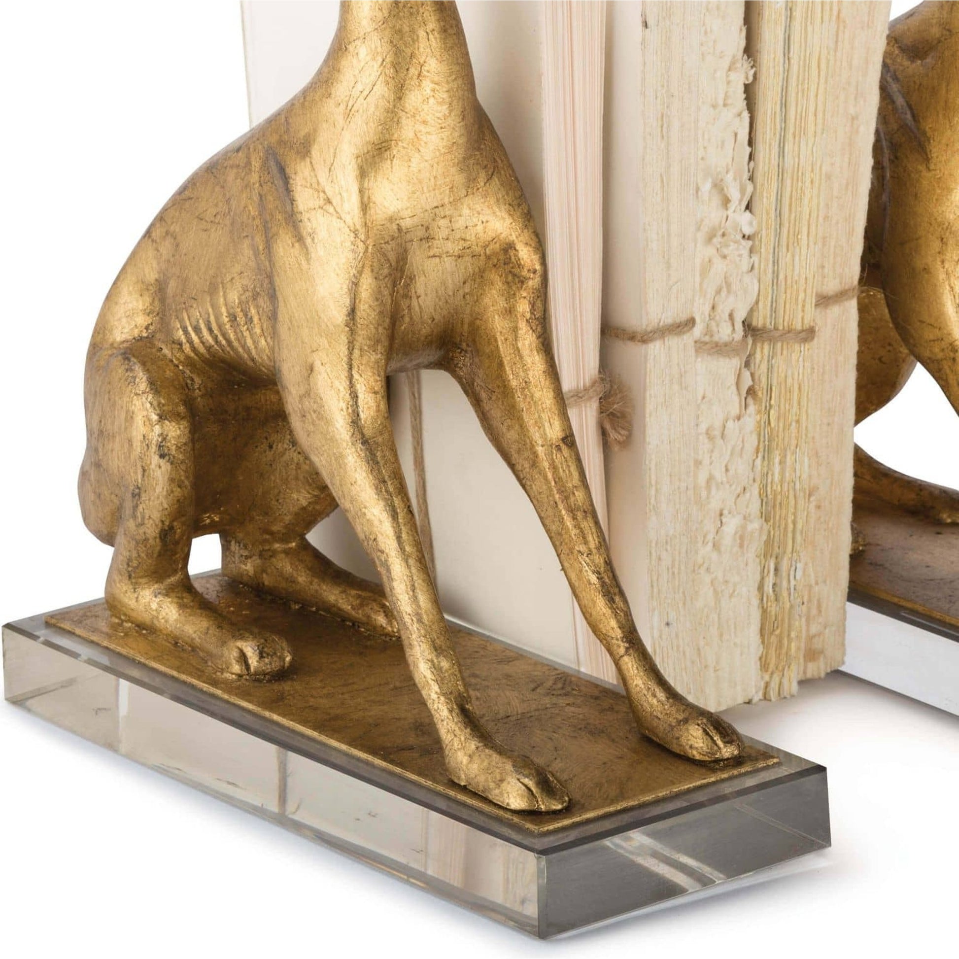 Norman Bookends by Regina Andrew in gold and antique gold leaf. Made from resin in a traditional style.
