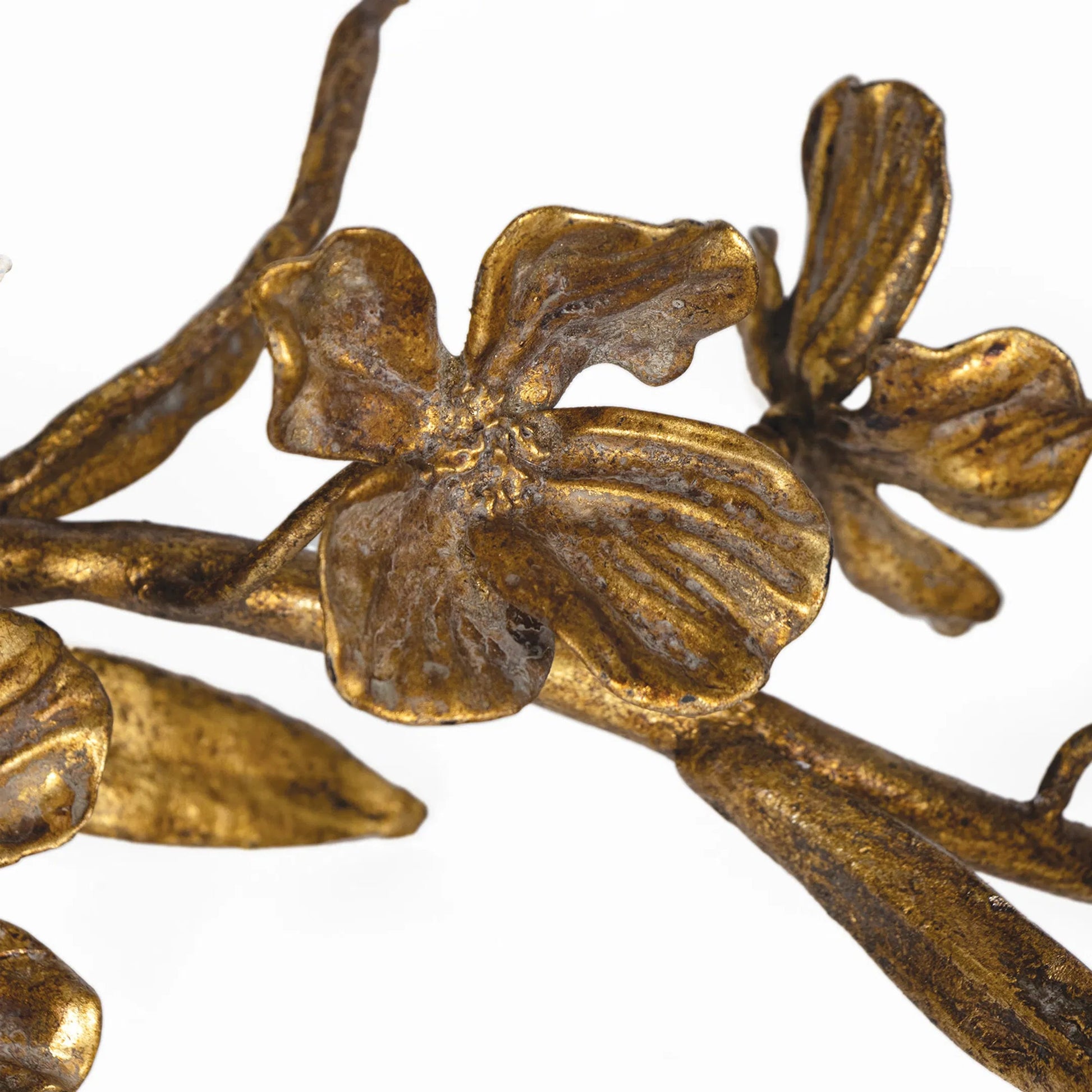 Dogwood Sprig by Regina Andrew in antique gold leaf. Made from steel in a modern style.