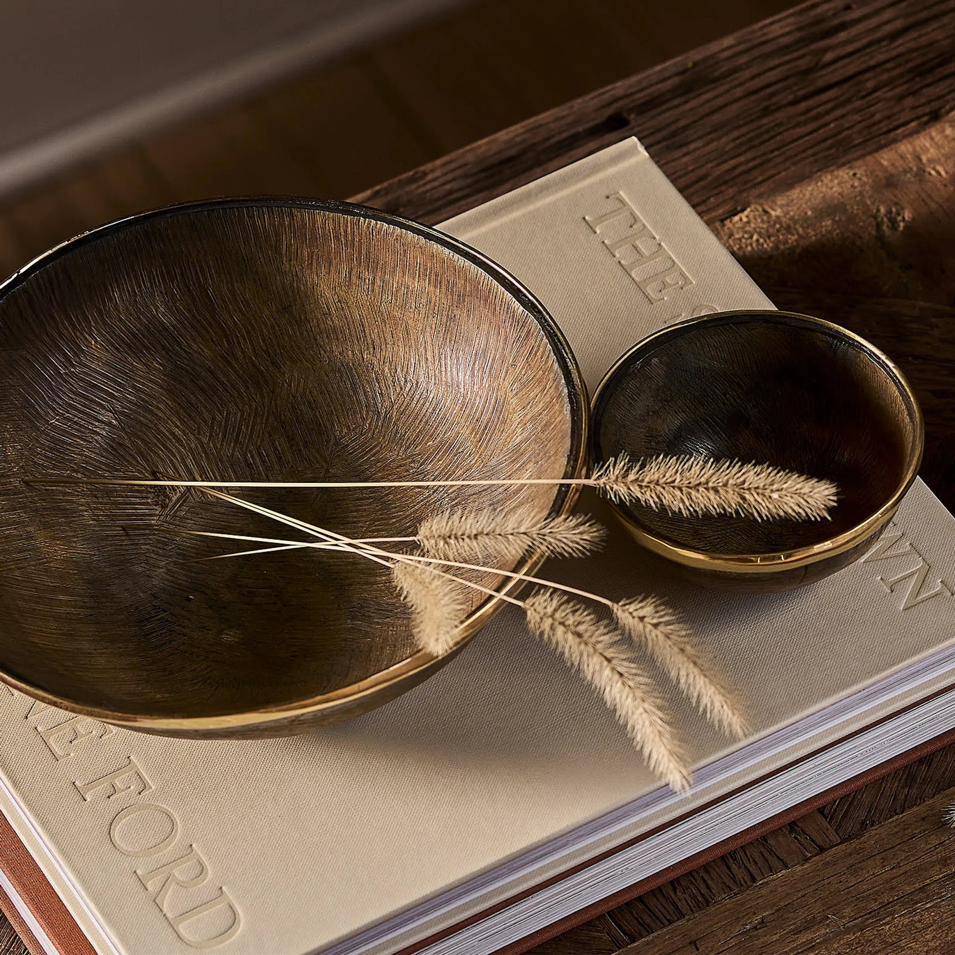 Cora Horn Bowl Set by Regina Andrew in brown and natural. Made from horn in a unique style.