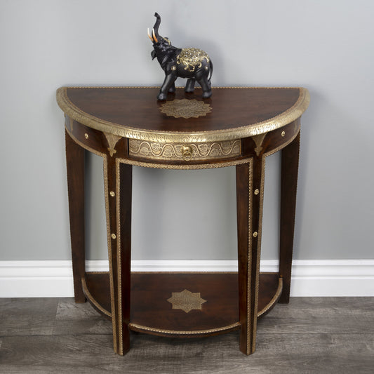 Ranthore Demilune Console Table by Butler Specialty Company in dark brown and artifacts. Made from mango wood solids, brass foil in a traditional style.
