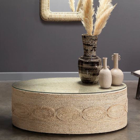 Barbados Oval Coffee Table by Jamie Young in off-white. Made from corn straw rope with tempered glass in a coastal style.