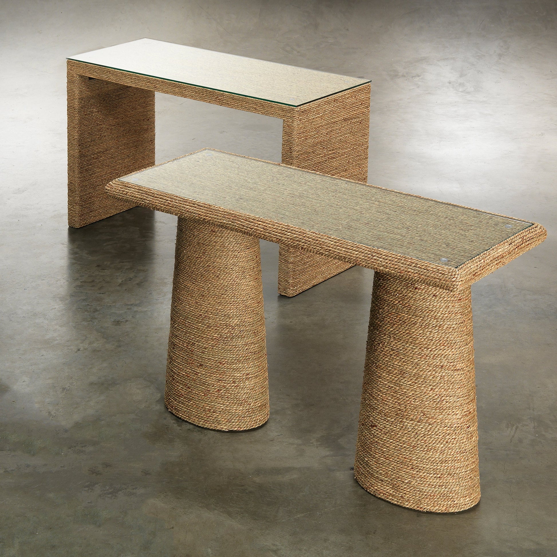 Captain Console Table by Jamie Young. Made from seagrass with tempered glass in a coastal style.