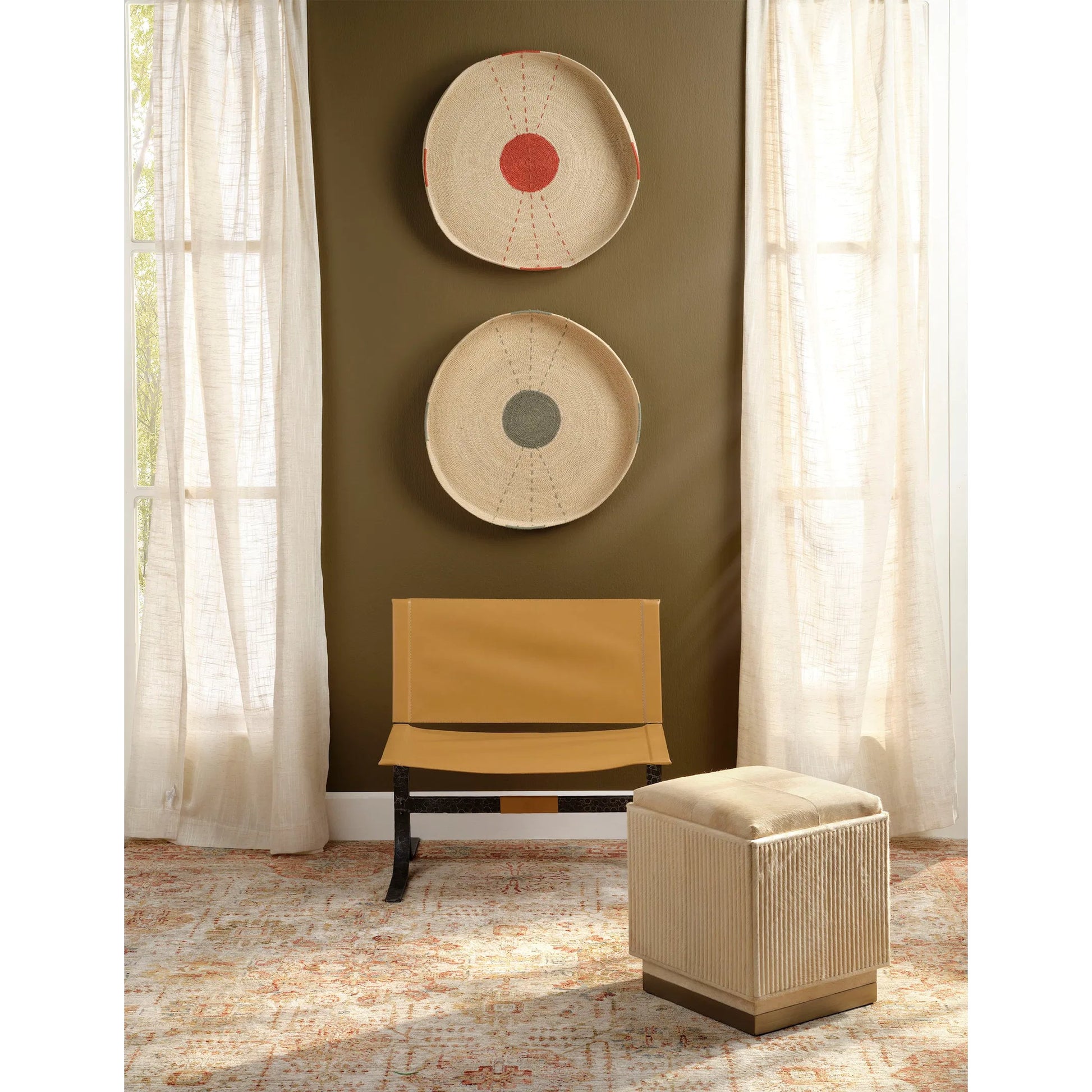 Easton Ottoman by Jamie Young. Made from hair on hide, mdf, metal: iron in a modern style.