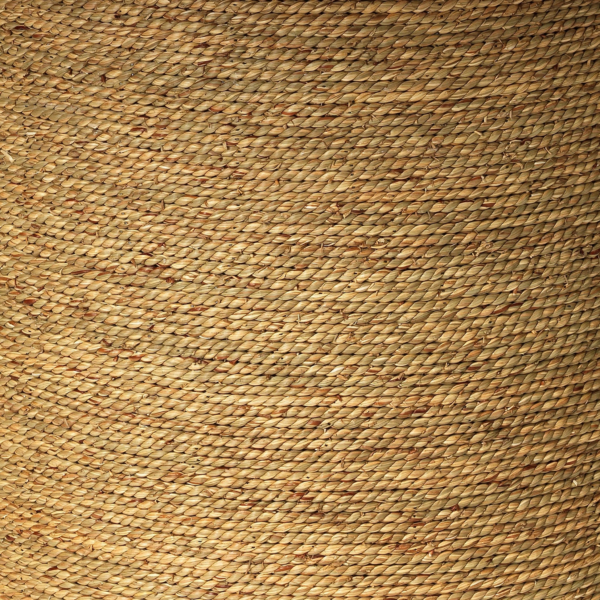 Harbor Round Bistro Table by Jamie Young. Made from seagrass with tempered glass in a coastal style.