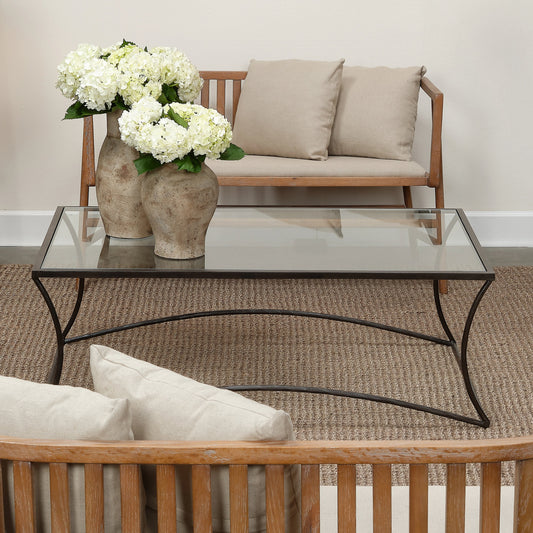 Kai Coffee Table by Jamie Young in black. Made from forged iron, clear tempered glass top in a modern style.
