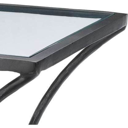 Kai Side Table by Jamie Young in black. Made from forged iron, clear tempered glass top in a modern style.