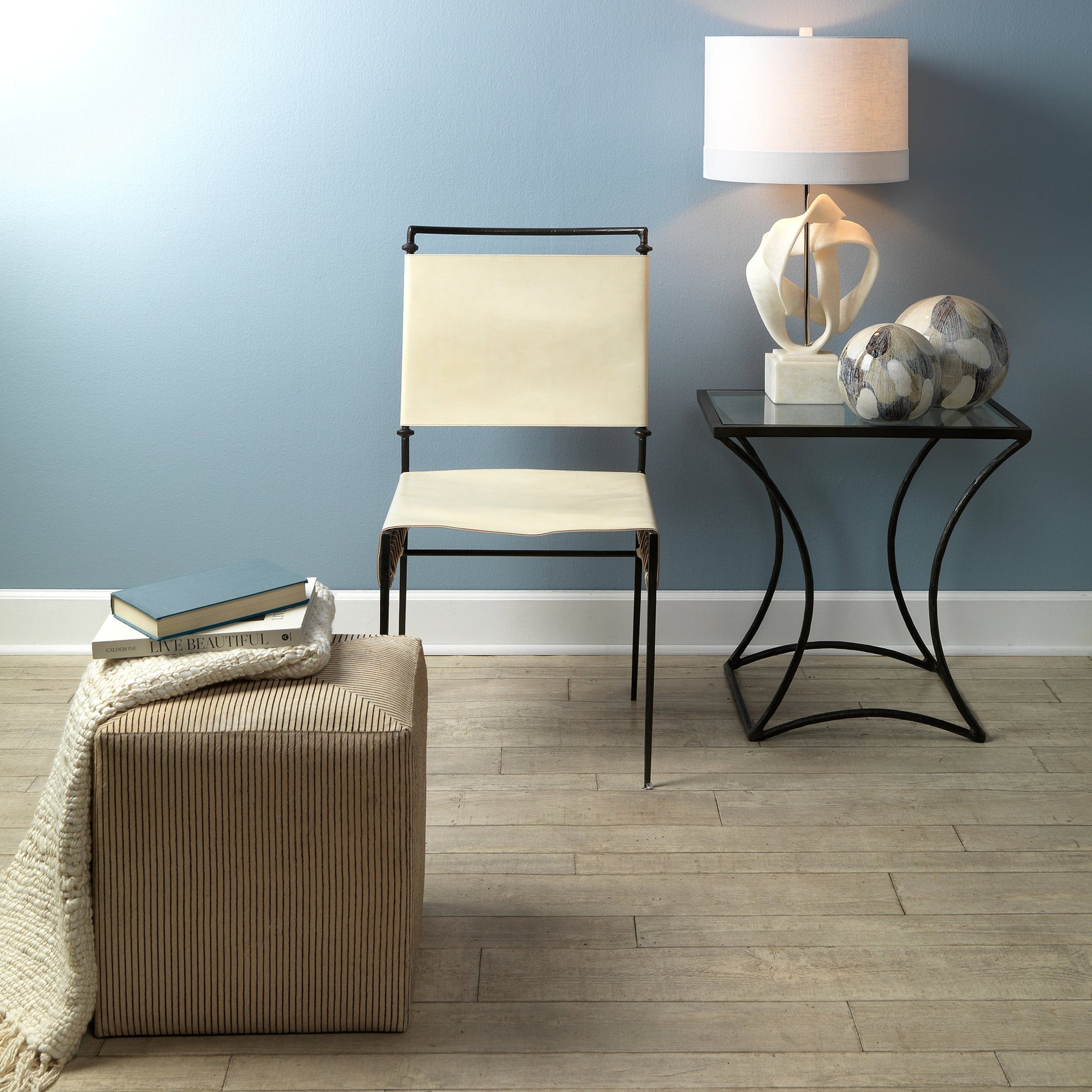 Kai Side Table by Jamie Young in black. Made from forged iron, clear tempered glass top in a modern style.