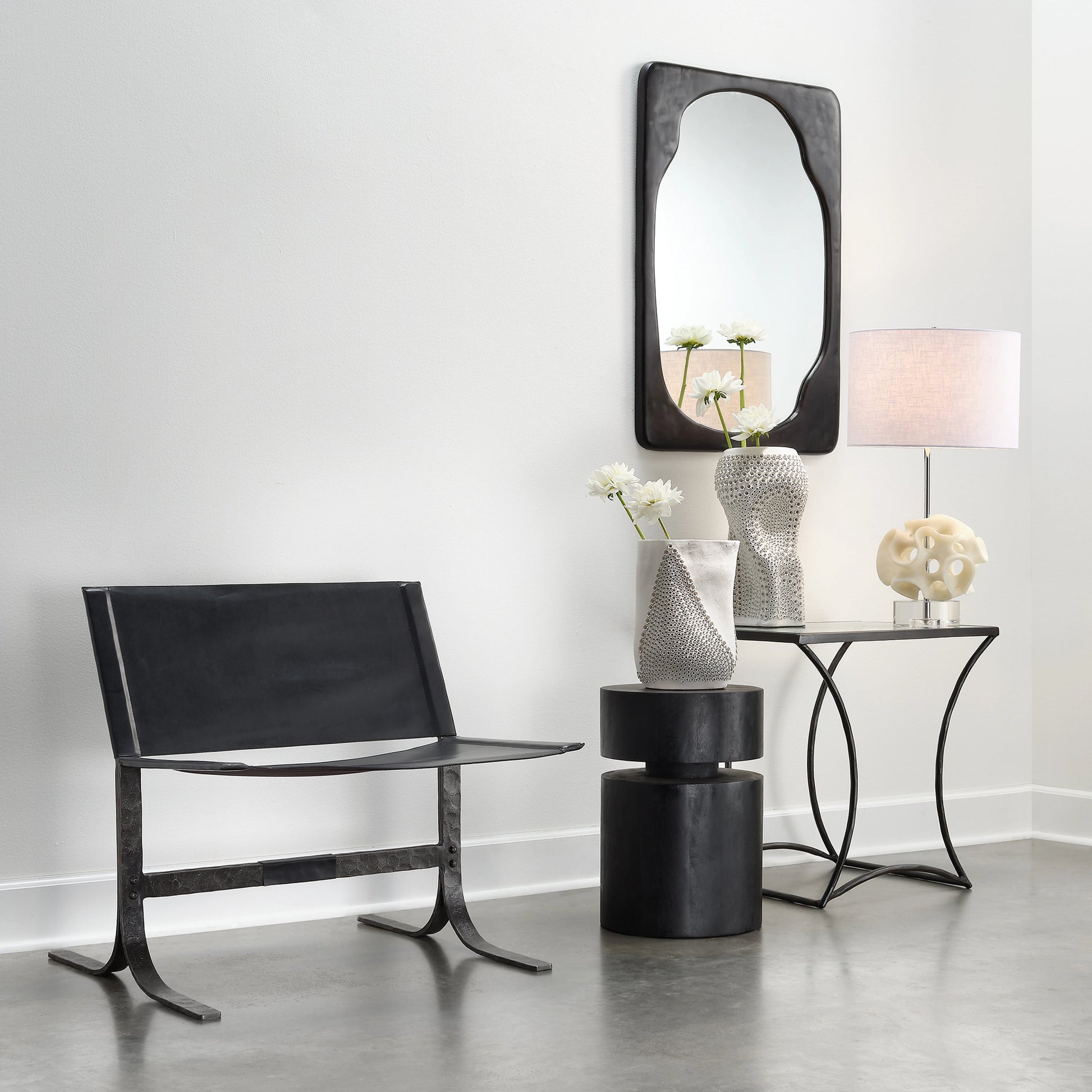 Kai Side Table by Jamie Young in black. Made from forged iron, clear tempered glass top in a modern style.