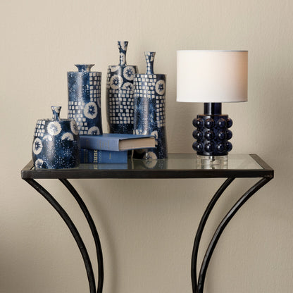 Kai Side Table by Jamie Young in black. Made from forged iron, clear tempered glass top in a modern style.