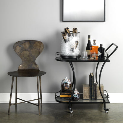 Mccallan Metal Chair by Jamie Young in acid washed metal. Made from iron in a rustic style.