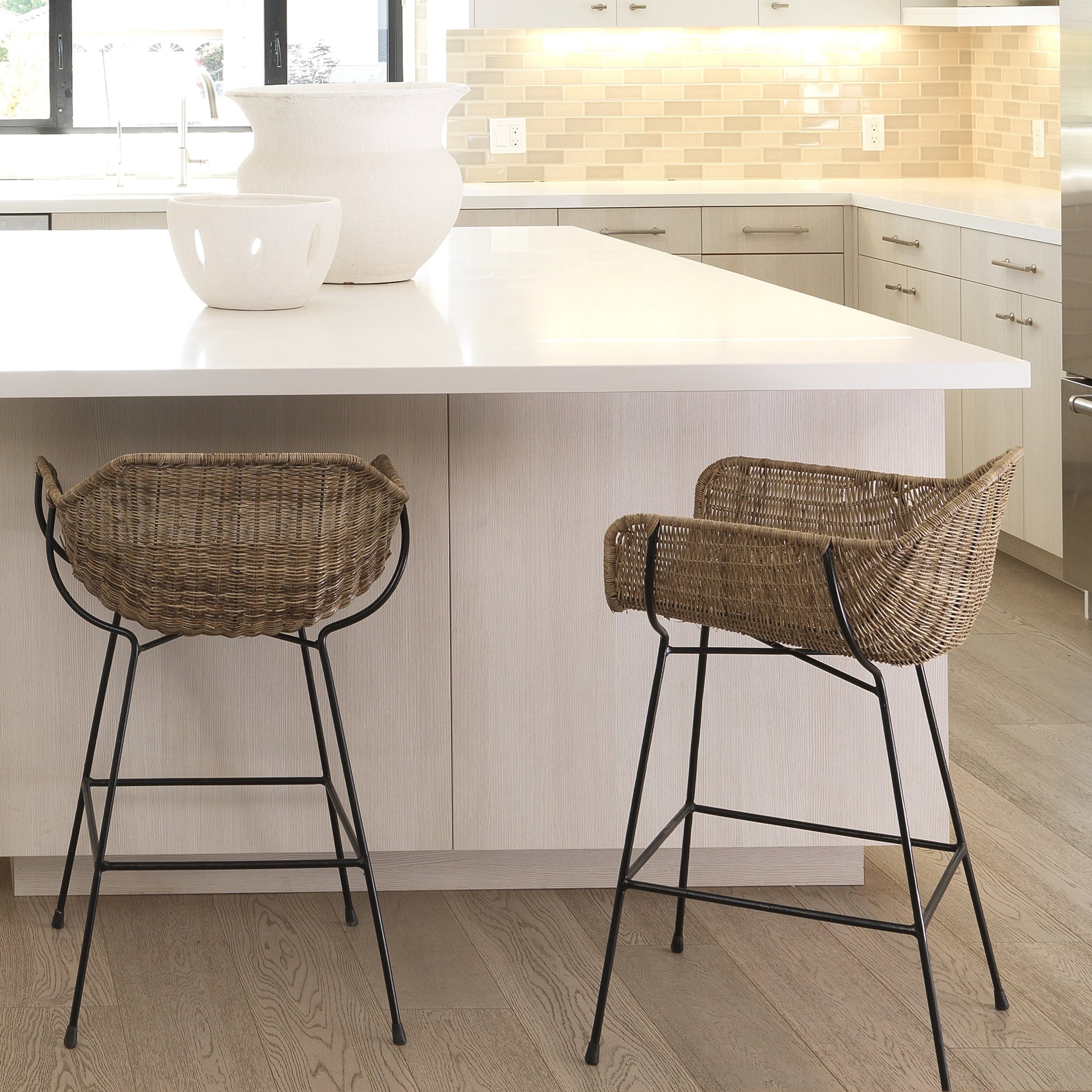 Nusa Counter Stool by Jamie Young in natural rattan, black steel. Made from steel, rattan slimit in a coastal style.