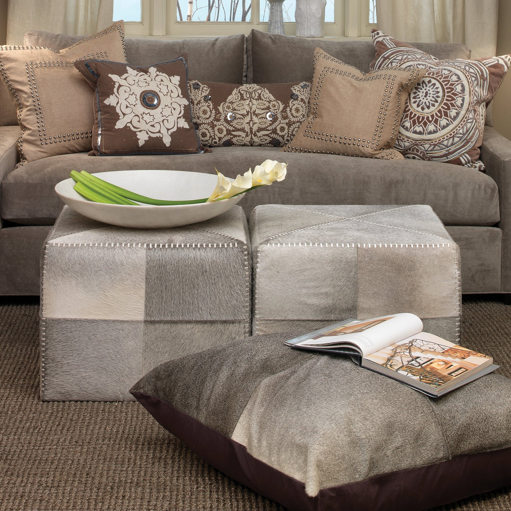 Large Ottoman by Jamie Young. Made from leather in a modern style.