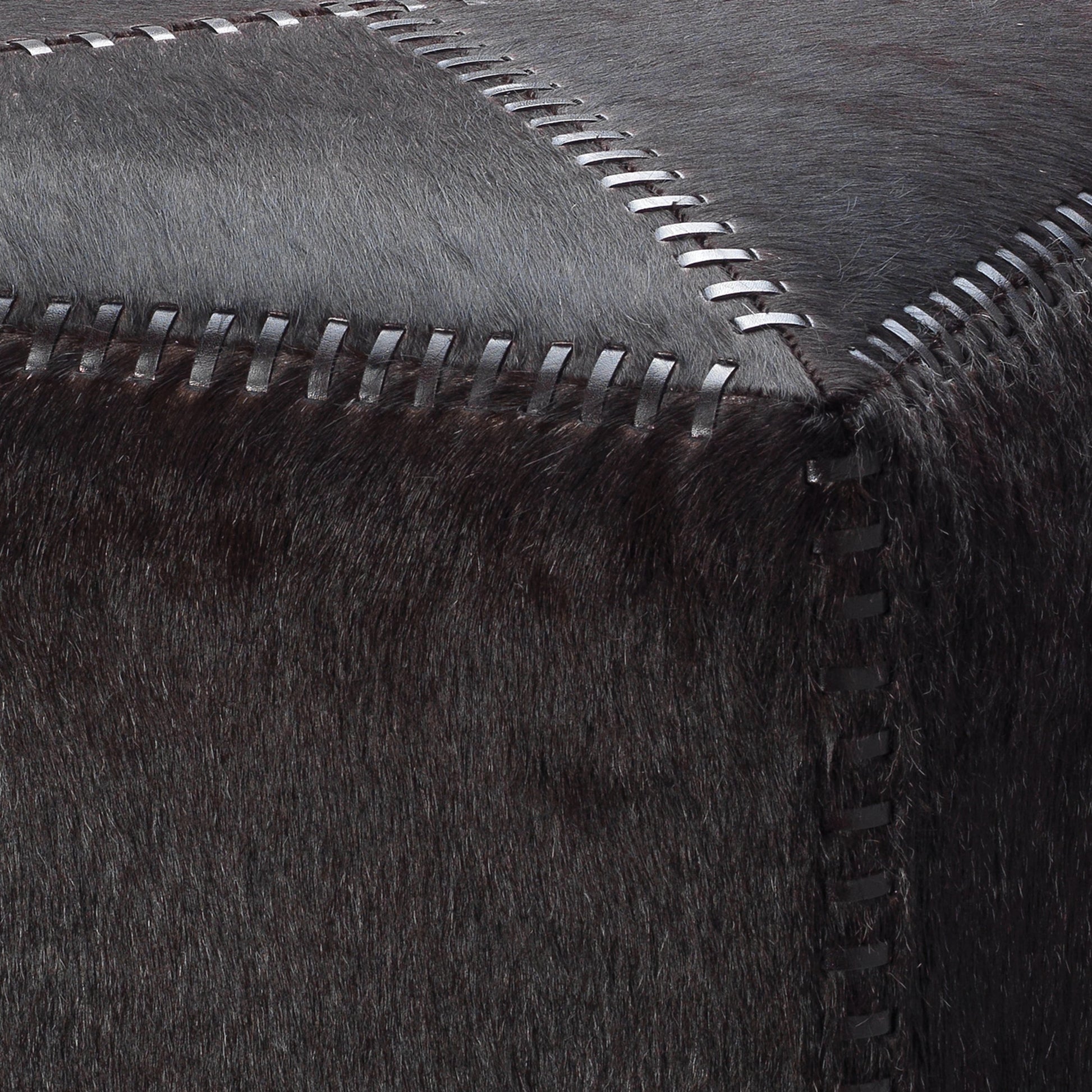 Small Ottoman by Jamie Young. Made from leather in a modern style.