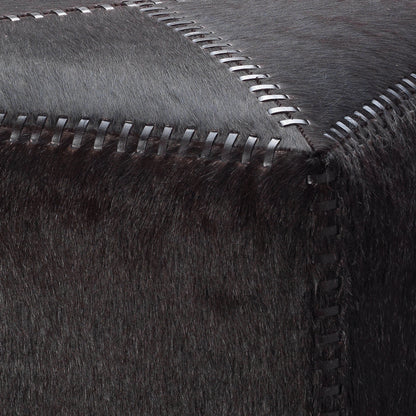 Small Ottoman by Jamie Young. Made from leather in a modern style.