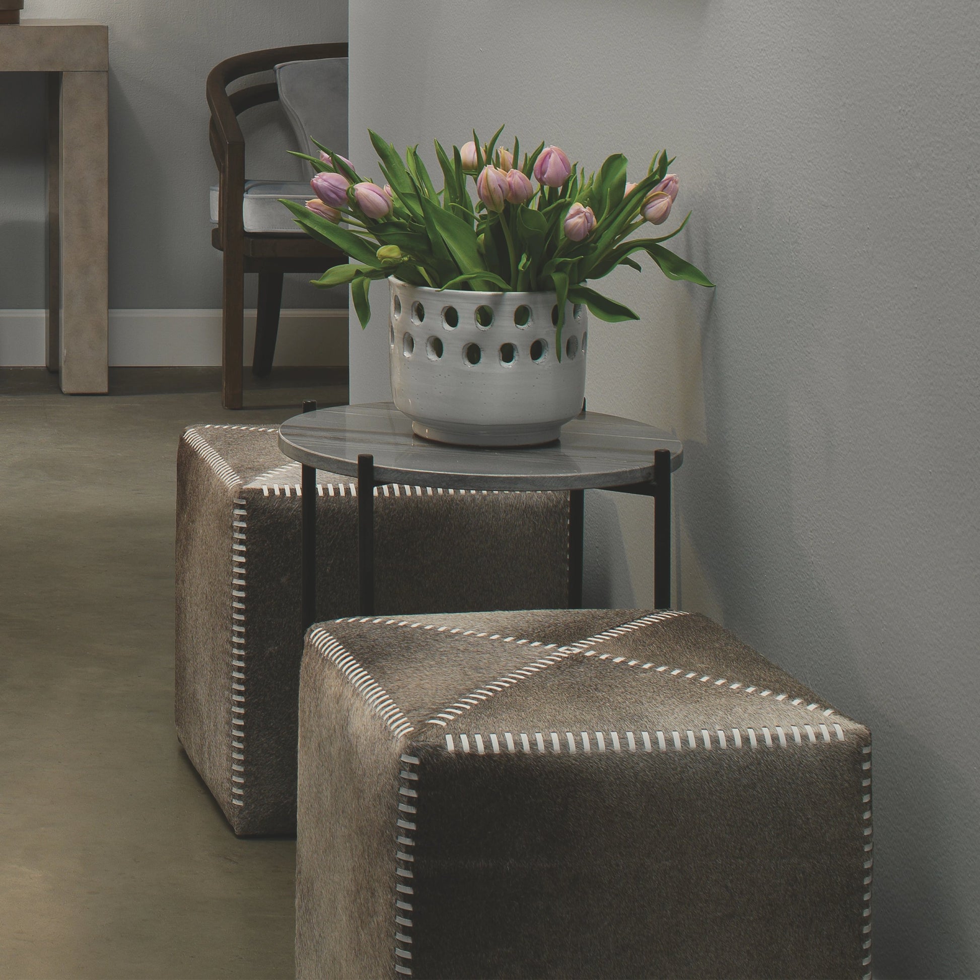 Small Ottoman by Jamie Young. Made from leather in a modern style.