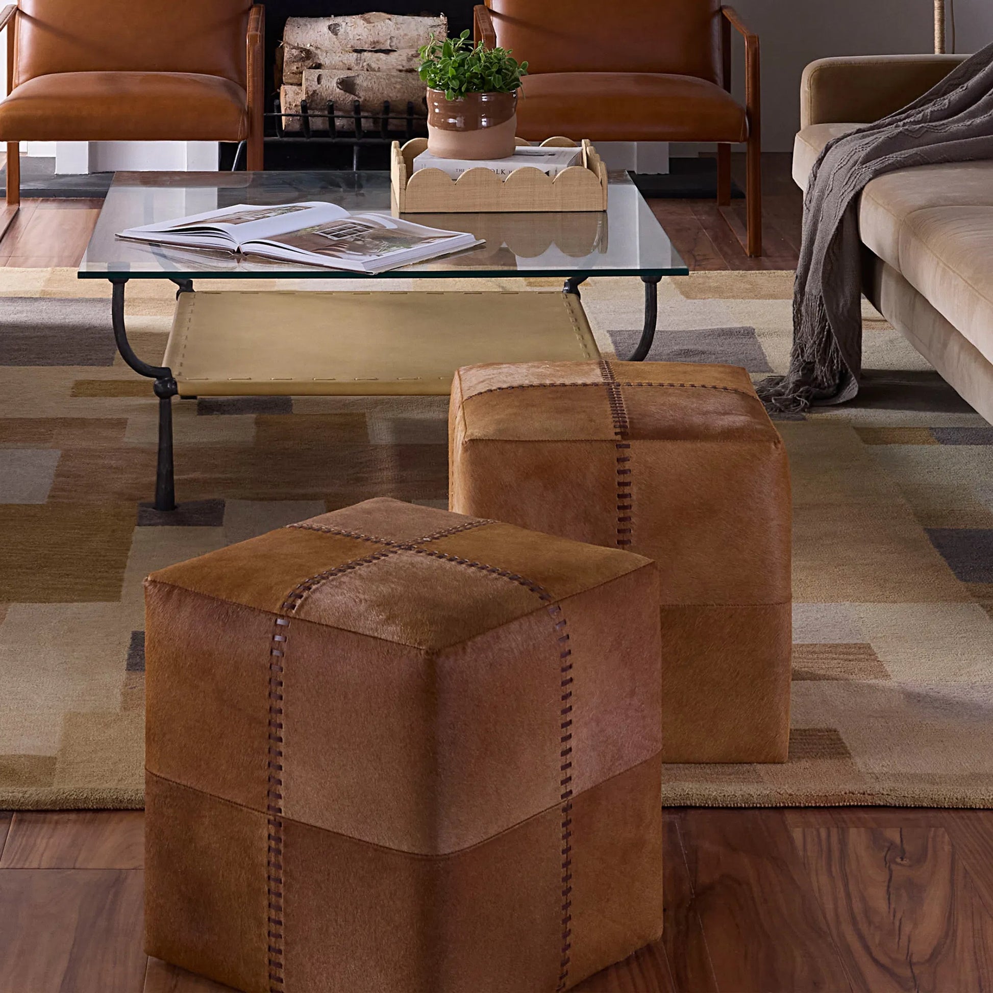Small Ottoman by Jamie Young. Made from leather in a modern style.