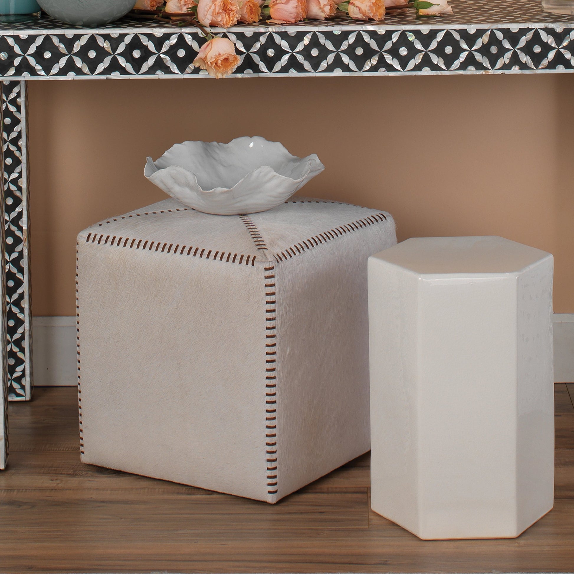 Small Ottoman by Jamie Young. Made from leather in a modern style.