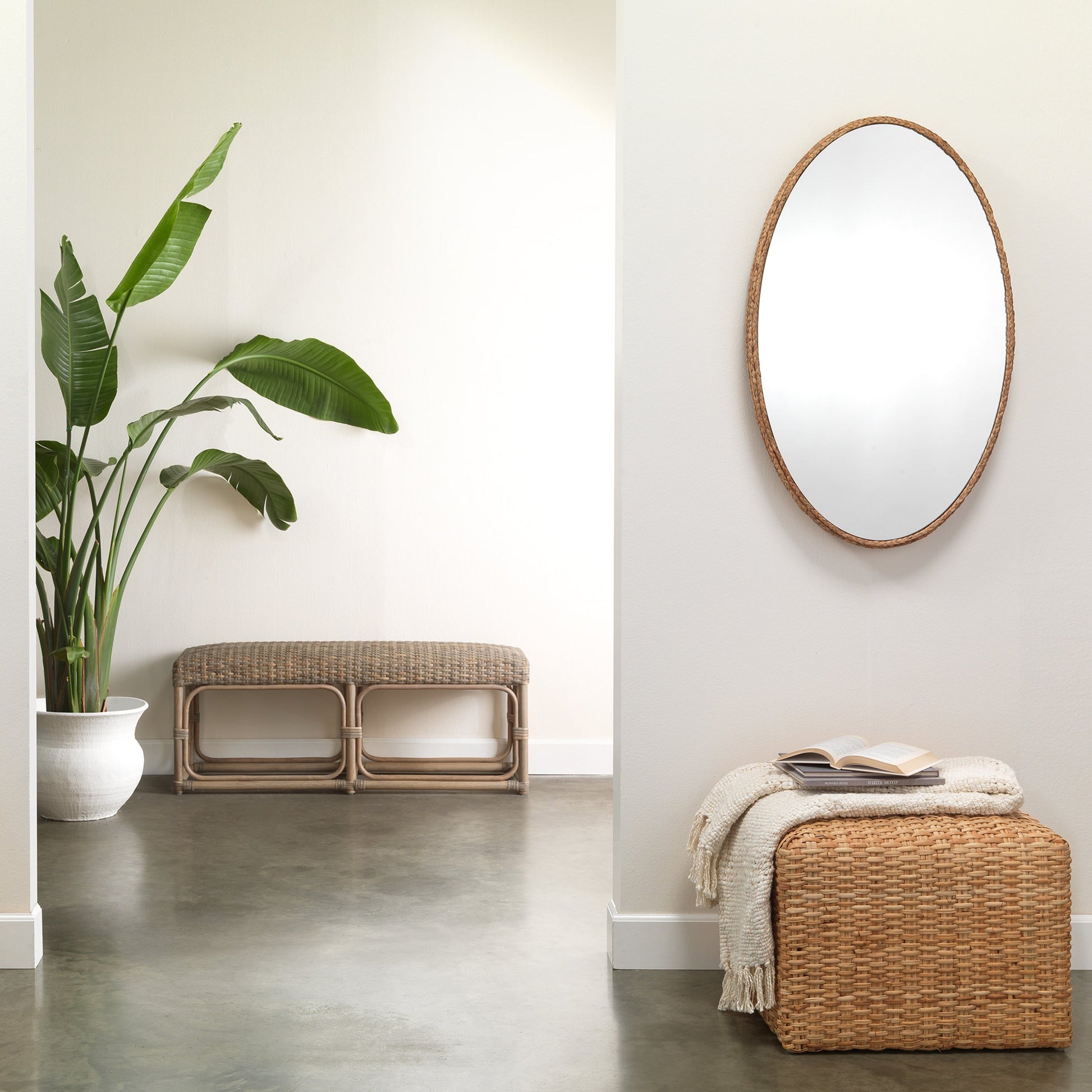 Rattan Ottoman by Jamie Young. Made from rattan in a modern style.