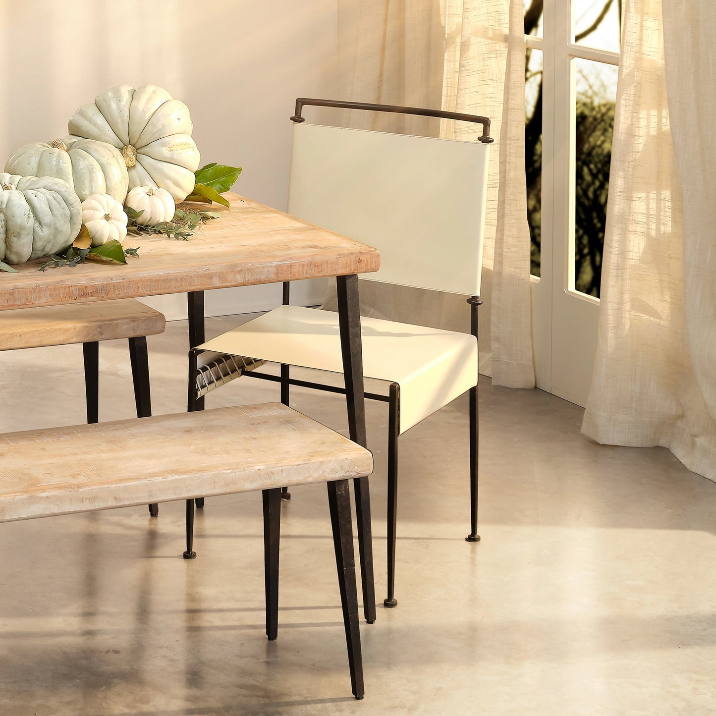 010 SI-1822231 | Lifestyle | Sweetwater Dining Chair by Jamie Young in off white leather & black forged iron. Made from leather, forged iron in a modern style.