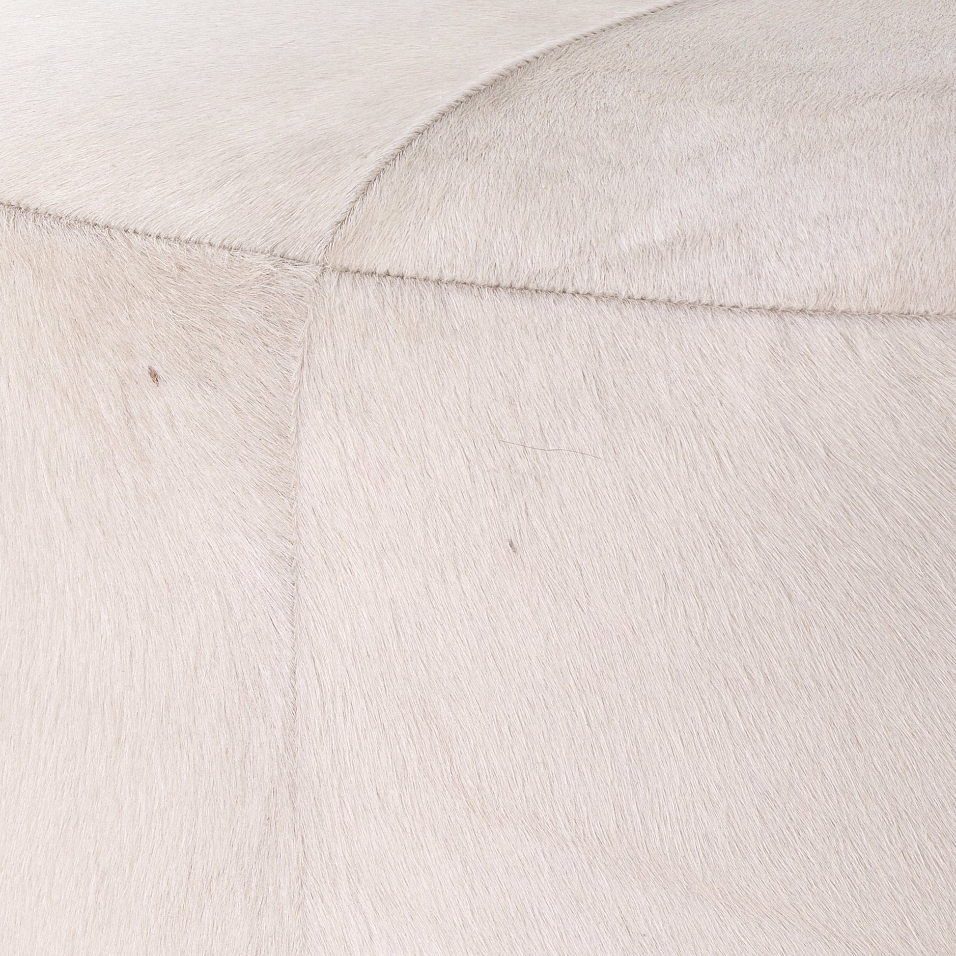 Thackeray Pouf by Jamie Young. Made from hide in a modern style.