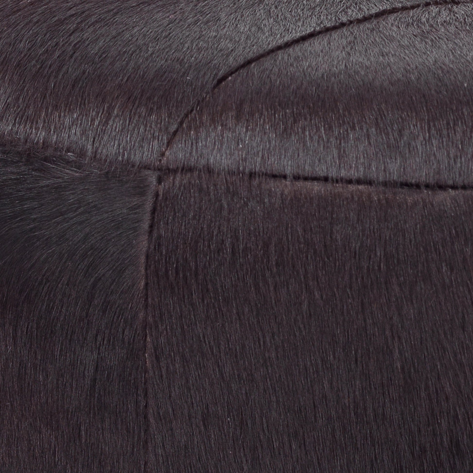 Thackeray Pouf by Jamie Young. Made from hide in a modern style.
