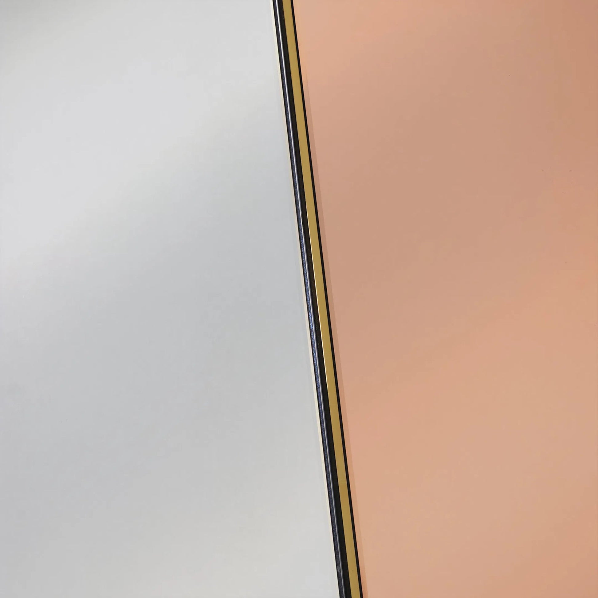 Iris Mirror by Regina Andrew in clear and gold. Made from stainless steel in a unique style.