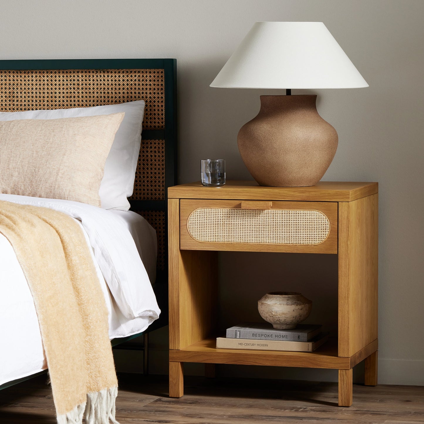 012 SI-1714150 | Lifestyle | Allegra Nightstand by Four Hands in honey oak veneer, light natural cane, honey oak and honey oak. Made from oak veneer, cane, solid oak in a rustic style.