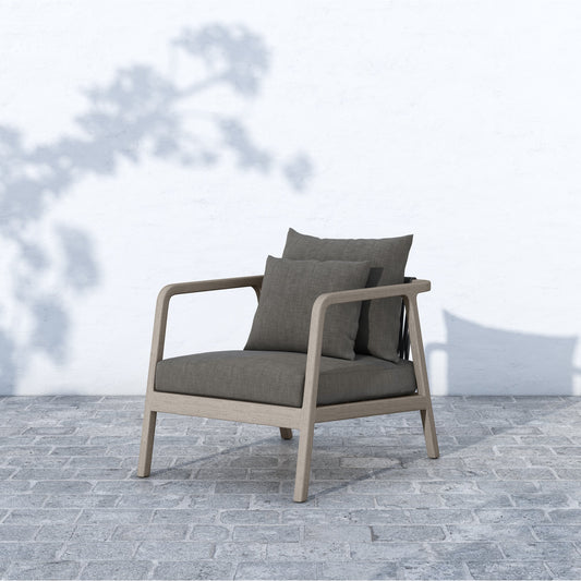 Numa Outdoor Chair - Weathered Grey by Four Hands. Made from 100% olefin, solid fsc®-certified teak, 100% polypropylene in a coastal style.