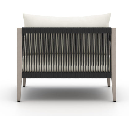 Sherwood Outdoor Chair, Weathered Grey by Four Hands. Made from 100% olefin, solid fsc®-certified teak, 100% polypropylene in a coastal style.