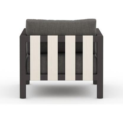 Sonoma Outdoor Chair by Four Hands. Made from 100% olefin, aluminum, 100% polypropylene in a coastal style.