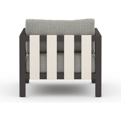 Sonoma Outdoor Chair by Four Hands. Made from 100% olefin, aluminum, 100% polypropylene in a coastal style.