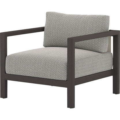 Sonoma Outdoor Chair by Four Hands. Made from 100% olefin, aluminum, 100% polypropylene in a coastal style.