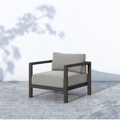Sonoma Outdoor Chair by Four Hands. Made from 100% olefin, aluminum, 100% polypropylene in a coastal style.