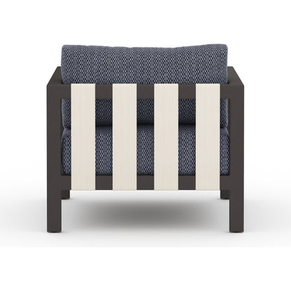 Sonoma Outdoor Chair by Four Hands. Made from 100% olefin, aluminum, 100% polypropylene in a coastal style.