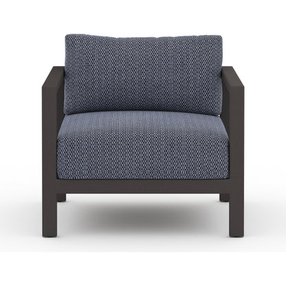 Sonoma Outdoor Chair by Four Hands. Made from 100% olefin, aluminum, 100% polypropylene in a coastal style.