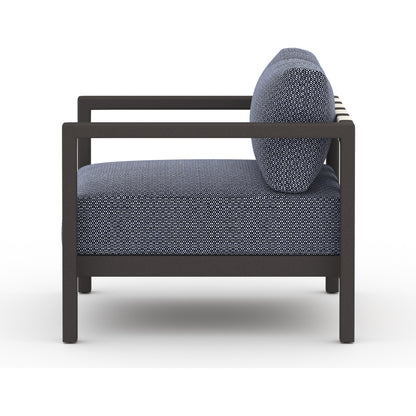 Sonoma Outdoor Chair by Four Hands. Made from 100% olefin, aluminum, 100% polypropylene in a coastal style.