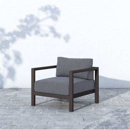 Sonoma Outdoor Chair by Four Hands. Made from 100% olefin, aluminum, 100% polypropylene in a coastal style.
