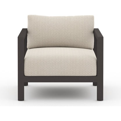 Sonoma Outdoor Chair by Four Hands. Made from 100% olefin, aluminum, 100% polypropylene in a coastal style.