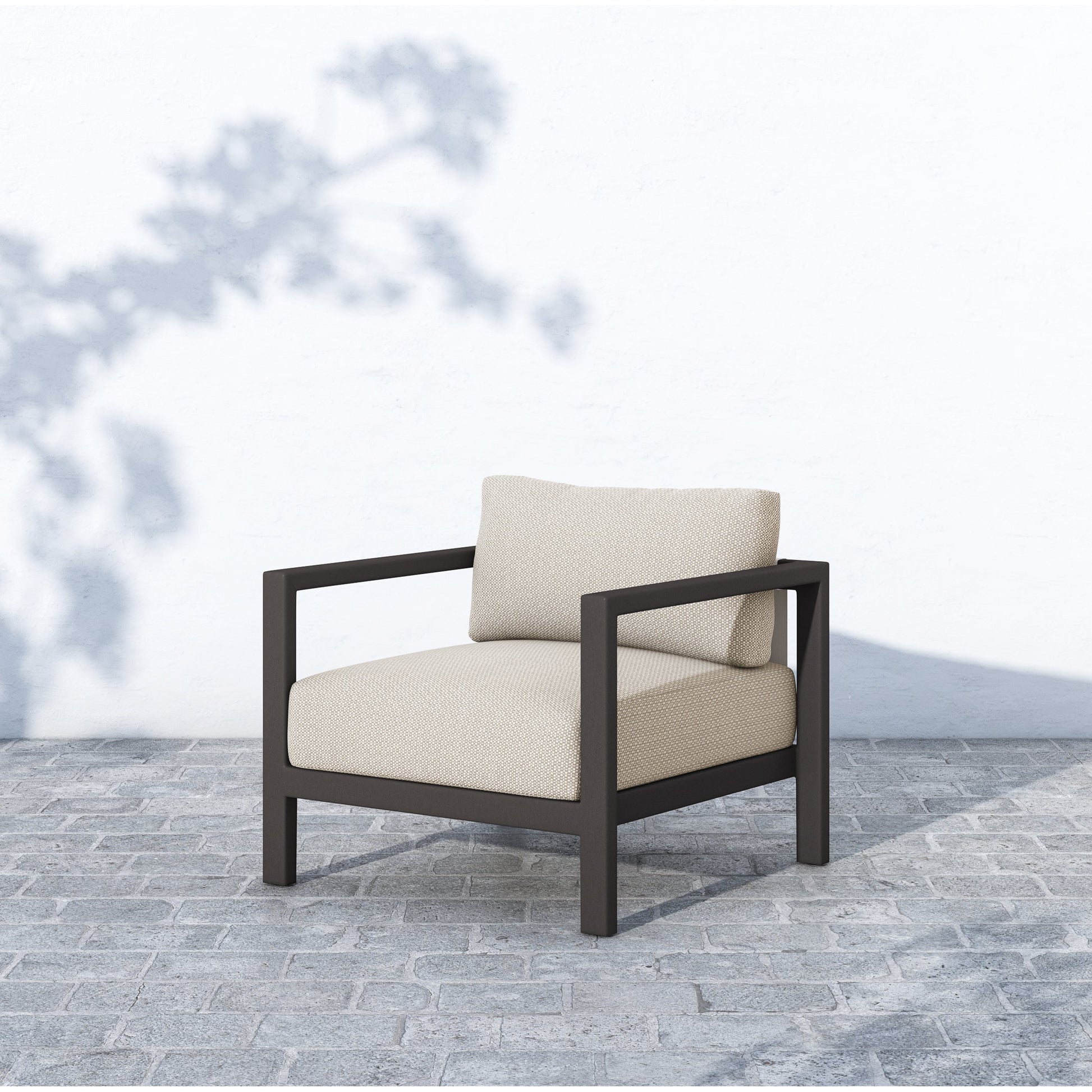 Sonoma Outdoor Chair by Four Hands. Made from 100% olefin, aluminum, 100% polypropylene in a coastal style.