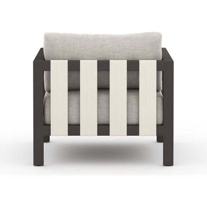 Sonoma Outdoor Chair by Four Hands. Made from 100% olefin, aluminum, 100% polypropylene in a coastal style.