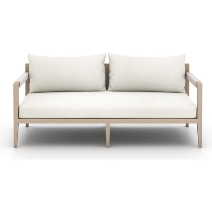 Sherwood Outdoor Sofa, Washed Brown by Four Hands. Made from 100% olefin, solid fsc®-certified teak, 100% polypropylene in a coastal style.