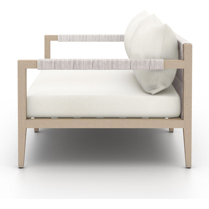 Sherwood Outdoor Sofa, Washed Brown by Four Hands. Made from 100% olefin, solid fsc®-certified teak, 100% polypropylene in a coastal style.