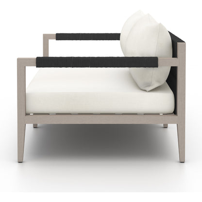 Sherwood Outdoor Sofa, Weathered Grey by Four Hands. Made from 100% olefin, solid fsc®-certified teak, 100% polypropylene in a coastal style.
