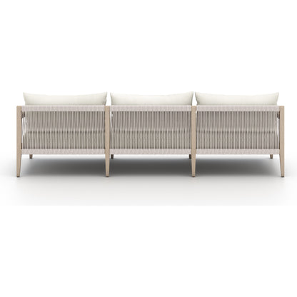 Sherwood Outdoor Sofa, Washed Brown by Four Hands. Made from 100% olefin, solid fsc®-certified teak, 100% polypropylene in a coastal style.