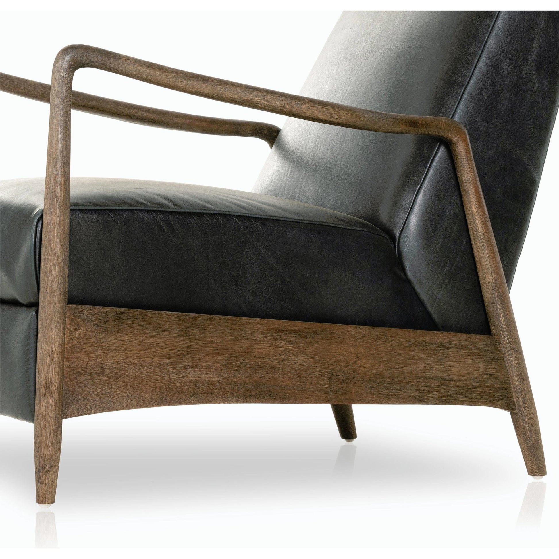 Braden Recliner by Four Hands in dakota black, rubbed sienna brown. Made from top grain leather, solid parawood, 100% polyester in a modern style.