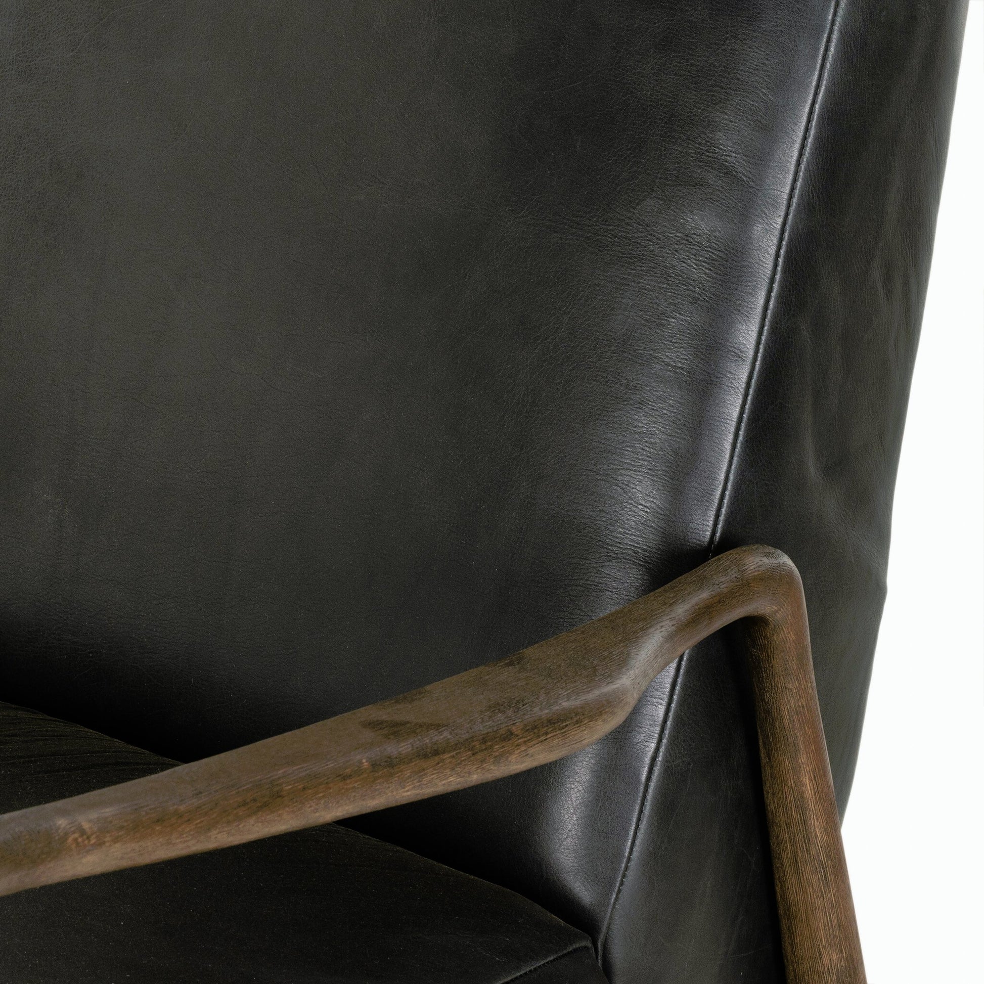 Braden Recliner by Four Hands in dakota black, rubbed sienna brown. Made from top grain leather, solid parawood, 100% polyester in a modern style.