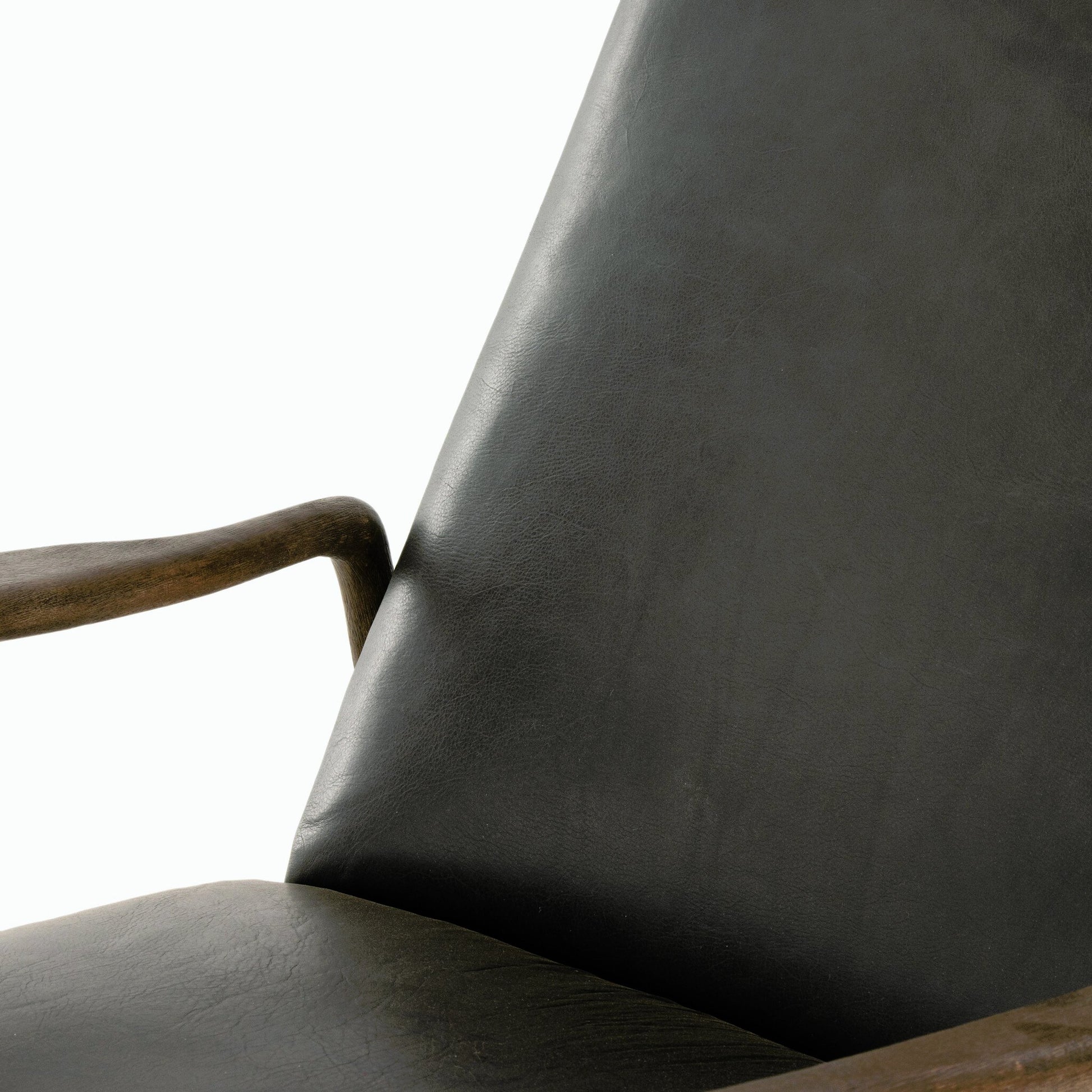 Braden Recliner by Four Hands in dakota black, rubbed sienna brown. Made from top grain leather, solid parawood, 100% polyester in a modern style.