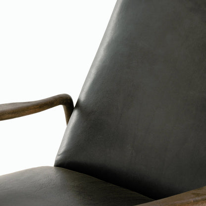 Braden Recliner by Four Hands in dakota black, rubbed sienna brown. Made from top grain leather, solid parawood, 100% polyester in a modern style.