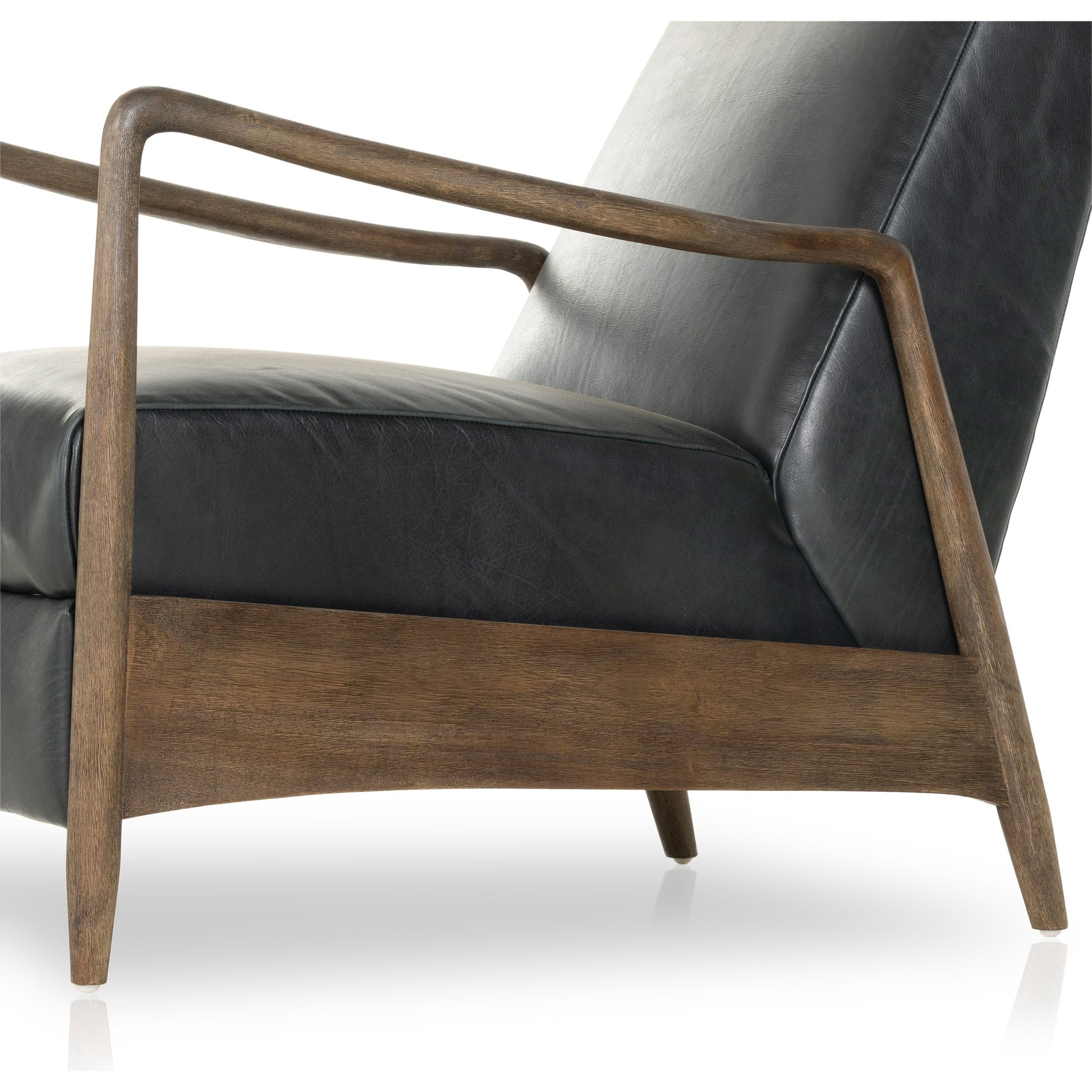 Braden Recliner by Four Hands in dakota black, rubbed sienna brown. Made from top grain leather, solid parawood, 100% polyester in a modern style.