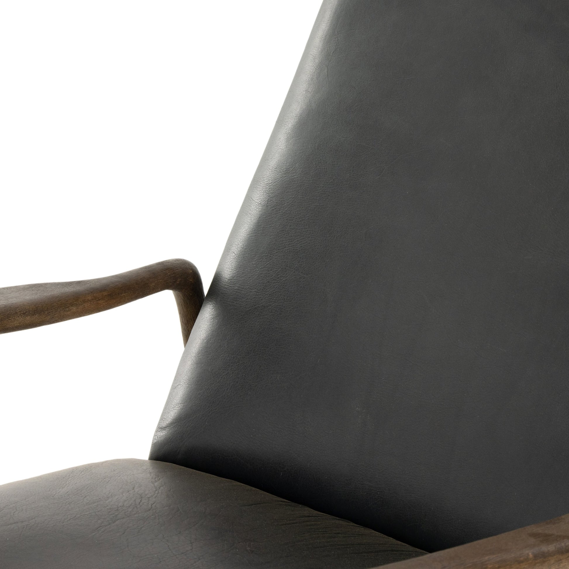 Braden Recliner by Four Hands in dakota black, rubbed sienna brown. Made from top grain leather, solid parawood, 100% polyester in a modern style.